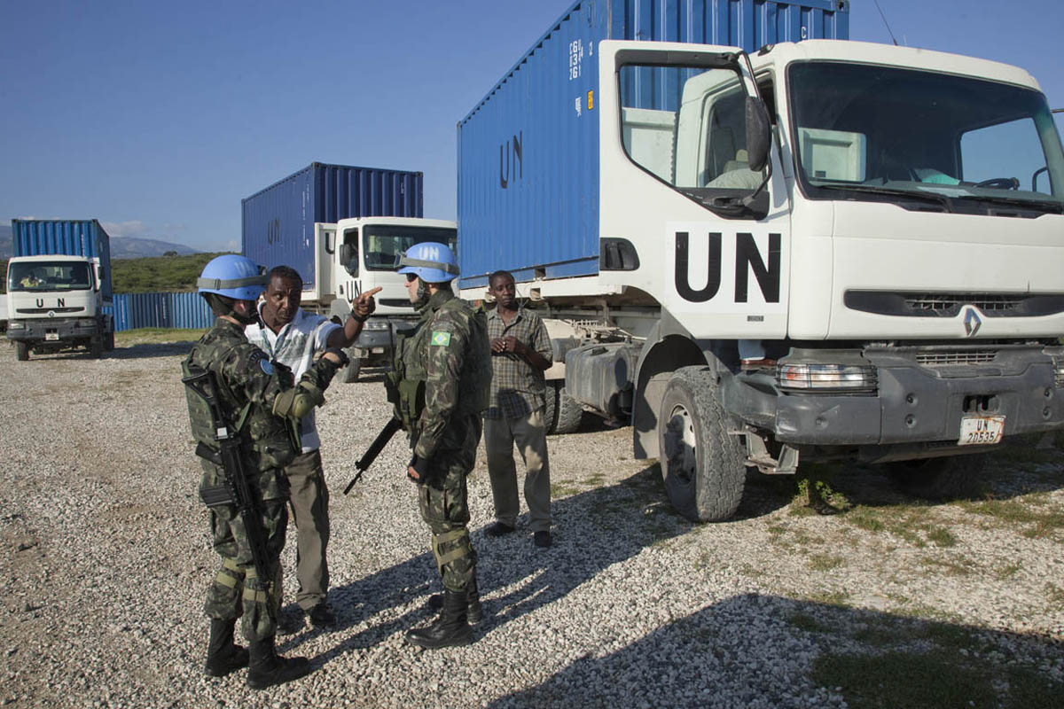 Brazilian troops arrive to escort a convoy of trucks carrying electoral materials as they depart Port au Prince to nine regions throughout Haiti. 