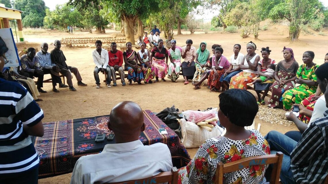 Non-profit organization AFIA MAMA facilitates a community dialogue with local authorities in Bukanda in the Democratic Republic of the Congo on women’s access to land for small farming in 2015. Photo courtesy Anny Modi