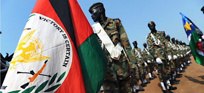 An officer of the Republic of South Sudan holds the new nation's flag during the Independence Ceremony.