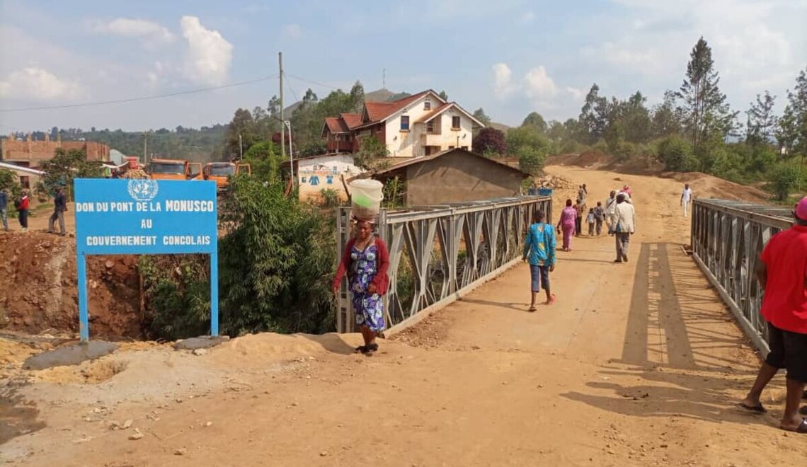 Civilians pass the newly built bridge in Nyangezi, DRC. Photo credit: UN Photo/MONUSCO