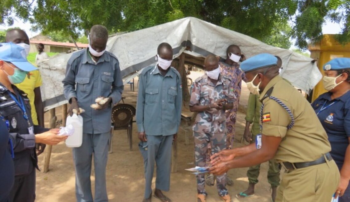 UN police officers in Rumbek distribute face masks and soap to South ...