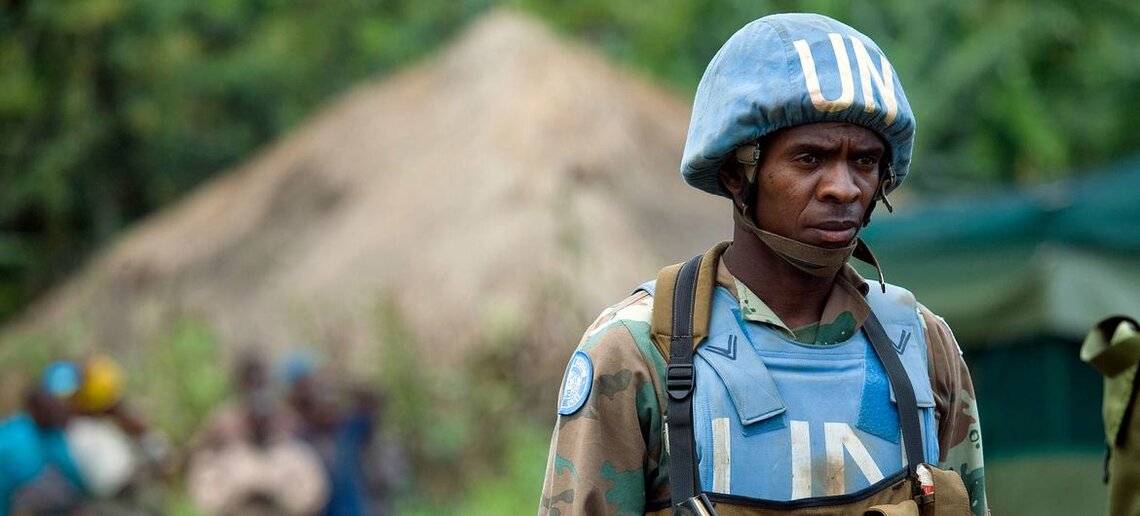 A member of MONUC’s South African parachute battalion on patrol duties around the village of Ntamugenga.