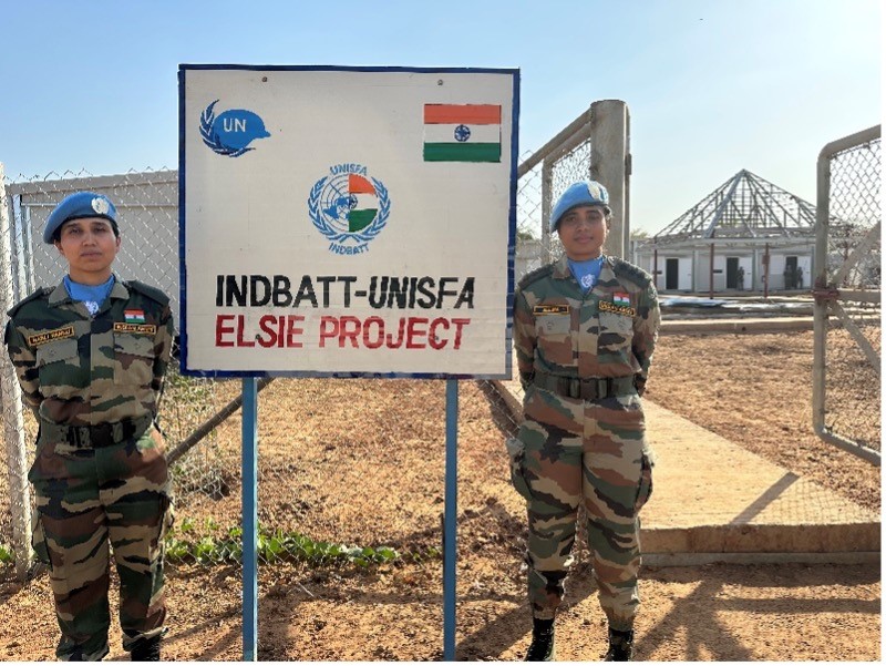 Members of the Indian Platoon stand in front of new gender-sensitive accommodation in Dukura. Photo by UNISFA (2023)