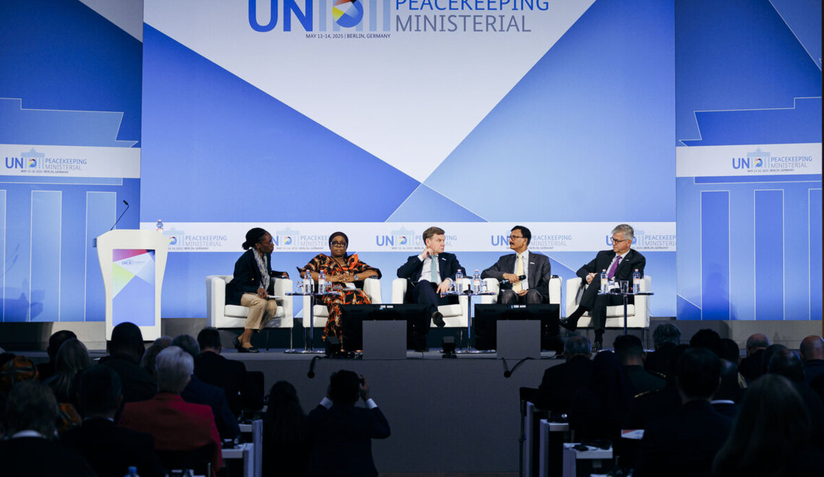 A panel of five people including the Under Secretary General for Peace Operations siting on a stage with a backdrop saying "UN Peacekeeping Ministerial 2025"