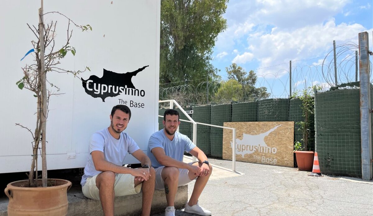 Steven Stavrou (left) and Burak Berk Doluay (right) together outside their multi-purpose space, called The Base, located in the UN Buffer Zone. Photo by CyprusInno.