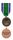 Originalmente, la medalla concedida por el servicio en el Congo era una cinta de color azul y blanco, como la bandera de la ONU, con una barra que indicaba que se había prestado servicio en el Congo. En 1963, se decidió que había que crear una cinta distintiva. La cinta concedida posteriormente presenta en el centro una banda ancha en verde, símbolo de esperanza, que se consideró el apropiado para representar a una nación joven y también a la cuenca del río Congo. 
