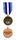 Медаль была учреждена в январе 1992 года; минимальный срок службы для ее получения составляет 90 дней. Лента медали состоит из пяти одинаковых по ширине полос, при этом в центре расположена полоса белого цвета, которая обрамлена полосами темно-синего цвета с расположенными по краям полосами голубого цвета, символизирующего ООН. Темно-синий и белый цвета — это цвета национального флага Сальвадора.