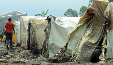 A man carries water in a camp for displaced people in Goma, in eastern Democratic Republic of the Congo.